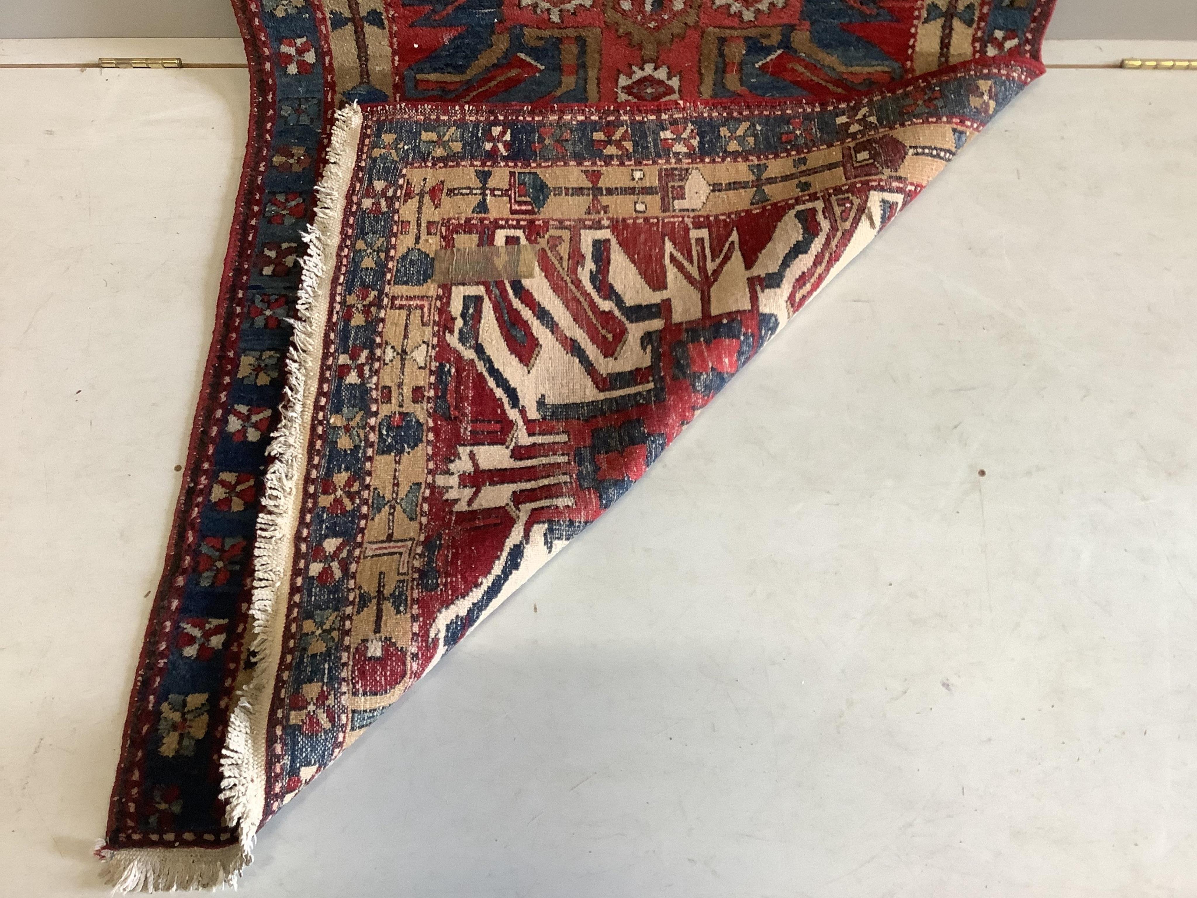A Caucasian runner with stylised eagle motifs, 330 x 103cm